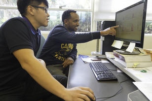 Two students at a computer